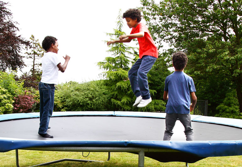 Kids Jumping on a Trampoline